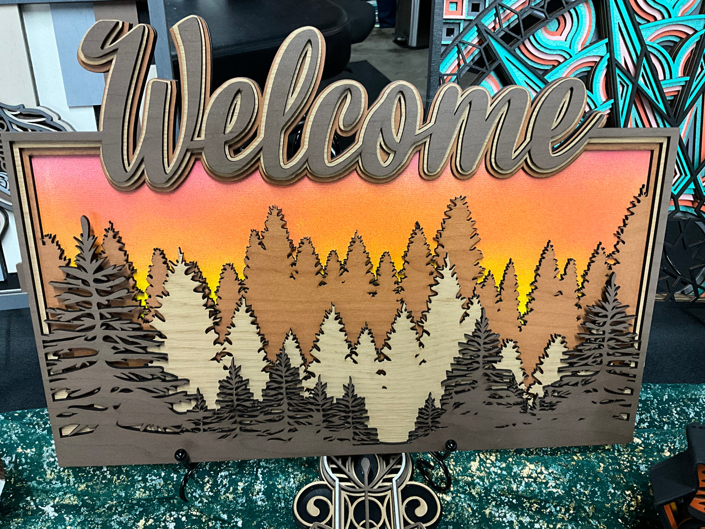 3D Layered Laser Cut Welcome Sign featuring a Forest and Glowing Sunset